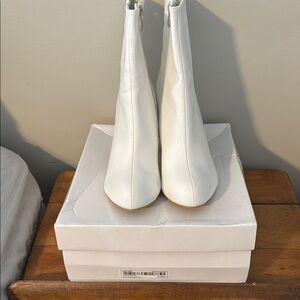 Sleek White Ankle Boots with Pointed Toe and High Heel